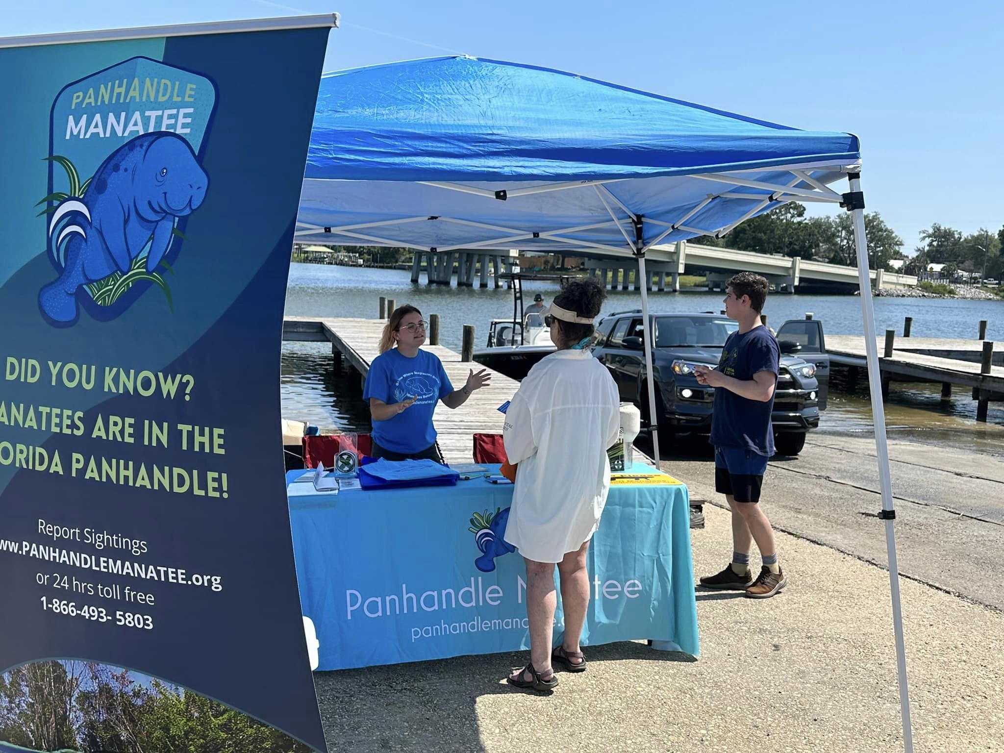 Manatee Intern speaking to people at boat ramp