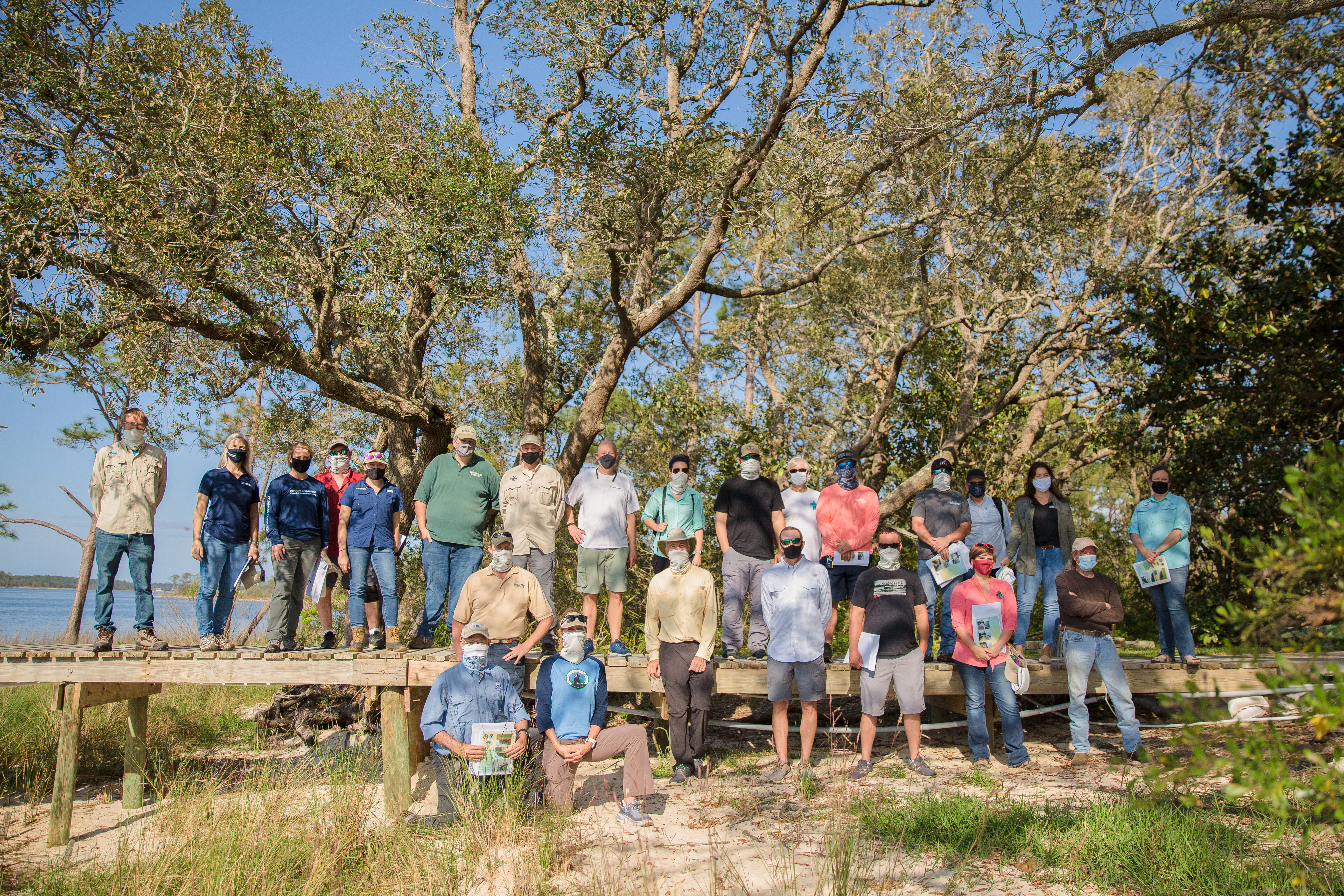 Participants in living shoreline course standing on a dock