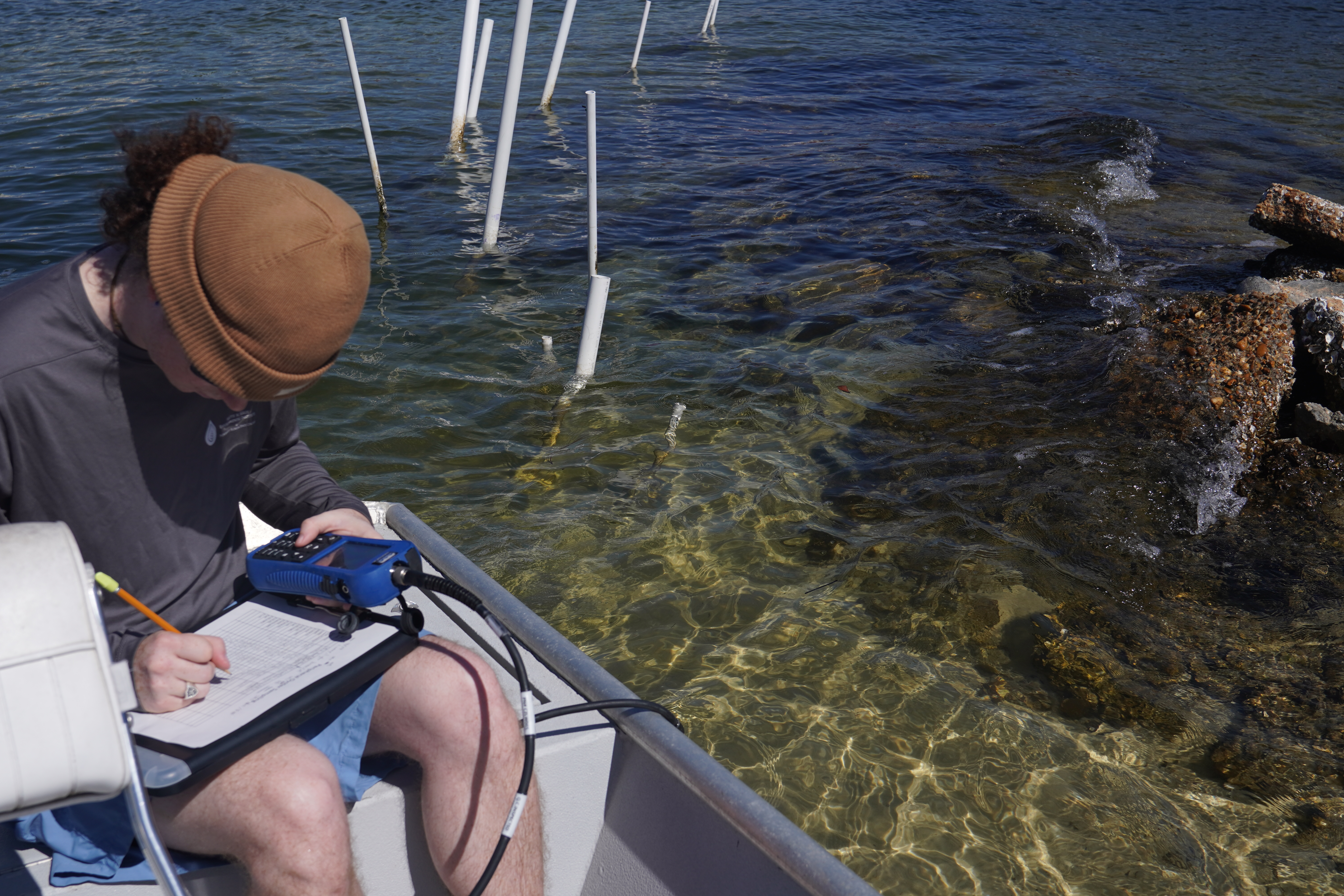 Researcher using water quality sonde